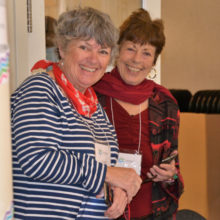 Colleen Kielbart, left, and Sada Ross, welcome people to the festivities.