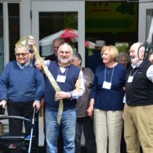President Tom Kilbane, left, brandishes the Chamber scissors!