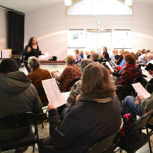 Evergreen Singers Director Jennifer Nehr led a special singalong session.