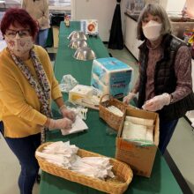 Rolling up spoons in napkins