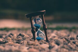 Hourglass with blue sand