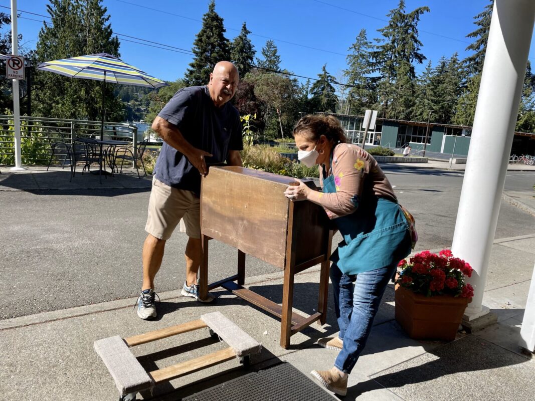 tijen and customer with a table
